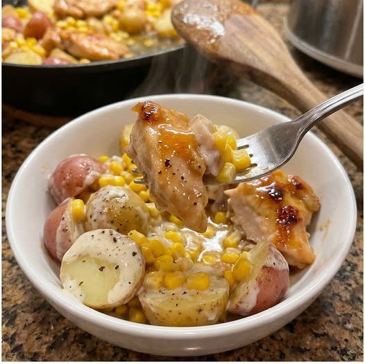 Finished crockpot honey butter chicken with ranch potatoes and sweet corn