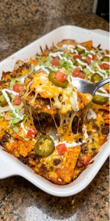 Finished loaded Dorito beef crunch tray with cheese and toppings